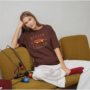 Deep brown cotton t-shirt with retro butter and caviar graphic print in a loose fit