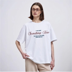 White oversized cotton t-shirt for women with vintage collegiate graphic print