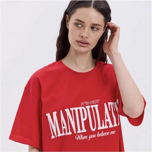 Oversized red cotton T-shirt with vintage white slogan print and drop shoulder design