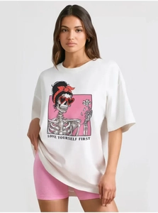 Detail of white cotton T-shirt featuring a cartoon skull illustration with Love Yourself text