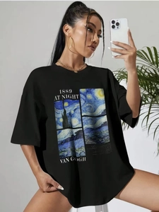 Detail of oversized black t-shirt featuring Van Gogh Starry Night print and 1889 text