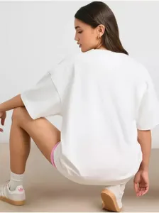Rear view of oversized white cotton t-shirt with dropped shoulders and loose fit