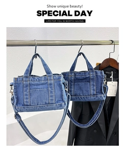 Detail of denim tote bag with contrast stitching and versatile shoulder straps for women