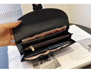 Detailed view of women black saffiano leather wallet with card slots and coin pocket