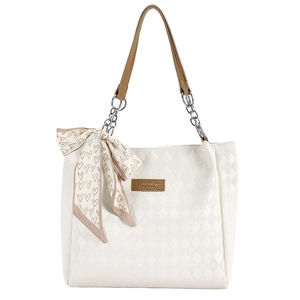 White quilted tote bag with brown leather straps and a decorative heart print scarf