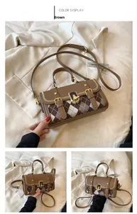 Detail view of brown checkered Boston bag with leather trim and gold twist lock closure