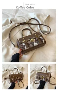 Detail view of coffee brown Boston bag featuring diamond lattice texture and metal buckles