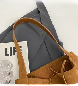 Top view of brown suede tote bag with drawstring closure and large interior capacity