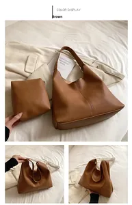 Brown lychee-textured large tote bag and matching clutch set for daily commute
