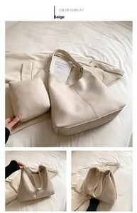Detail view of cream white tote bag set with pebble faux leather and matching small pouch