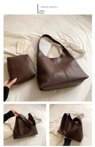 Detail of dark brown litchi pattern tote bag and matching pouch in a home setting