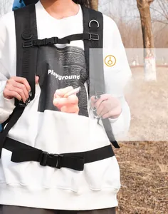 Detail of adjustable chest and waist straps on a 90L durable outdoor hiking backpack