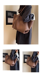 Detail of brown woven leather tote bag featuring classic mesh texture and shoulder strap
