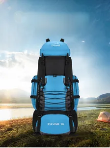 Detailed close-up of 90L blue and black hiking backpack with bungee cords and buckles