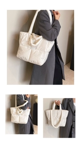 Close-up of high-gloss white quilted puffer tote bag with premium stitched texture