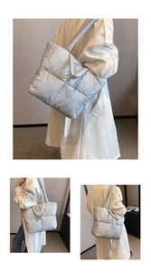 Detail view of silver puffer tote bag showing quilted texture and shimmering metallic finish