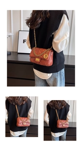 Detail of brick red quilted shoulder bag featuring gold chain strap and metal lock closure