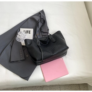 Spacious black woven leather tote bag with Intrecciato pattern and long shoulder straps