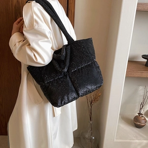 Black quilted down tote bag with shimmering finish and large puffer design for women