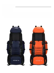 Detail view of 90L outdoor backpacks in dark blue and orange with nylon texture