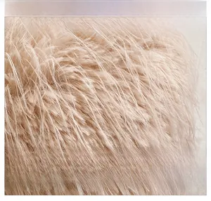 Detailed macro view of the soft fluffy faux fur fabric in light pink for the heart bag