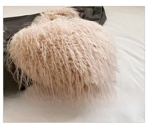 Detailed close-up of fluffy apricot plush bag texture and soft faux fur material