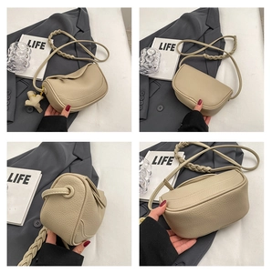 Detail view of beige lychee leather saddle bag with woven strap and charm in four angles