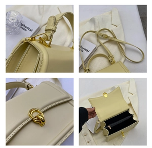 Detail view of cream crossbody bag featuring gold hardware and layered internal pockets