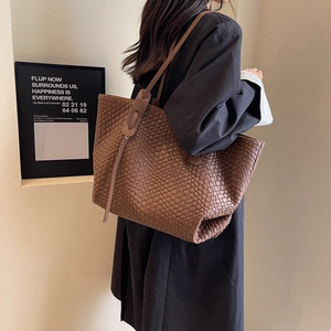 Brown woven large tote bag with retro diamond pattern and slender shoulder strap