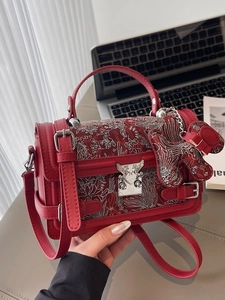 Elegant red floral embroidery handbag with top handle and silver hardware clasp