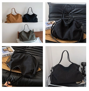 Detail of minimalist large tote bag in black, brown, and dark green with matte texture
