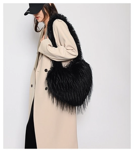 Detailed view of the black faux fur tote bag with long fluffy texture and large capacity