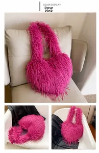 Detail view of the plush heart-shaped tote bag in vibrant rose pink faux fur texture