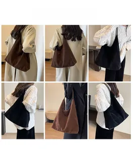 Detail view of large vintage suede tote bag showing texture and fit in brown and black