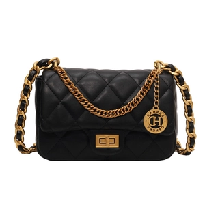 Elegant black quilted crossbody bag with gold chain strap and signature turn-lock closure