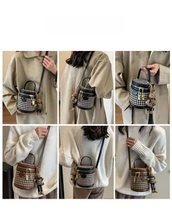 Detailed views of vintage houndstooth bucket bag with leather trim and rabbit charm