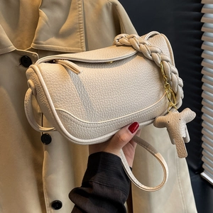 Off-white lychee grain leather dumpling bag with woven handle and cute elephant charm