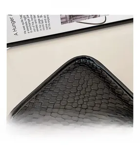 Close-up of the black woven texture and fine edge stitching on the large shoulder bag