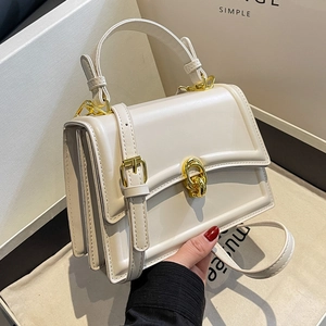 Elegant cream white square handbag with golden twist lock and adjustable shoulder strap