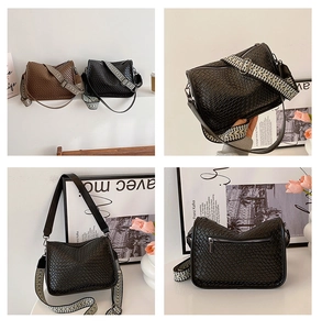 Detail of woven texture, ethnic patterned shoulder strap and back zipper on crossbody bag
