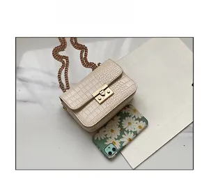 Detailed comparison of off-white crocodile pattern mini bag with chain strap and phone