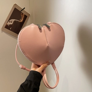 Sac à bandoulière rose en cuir PU en forme de cœur avec double fermeture éclair argentée