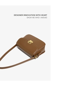 Close-up of caramel brown leather handbag featuring a golden rectangular twist lock buckle