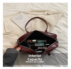 Interior view showing the large storage capacity of the vintage leather baguette bag