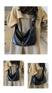 Detail view of large black pleated Hobo shoulder bag with cloud-style ruffled strap