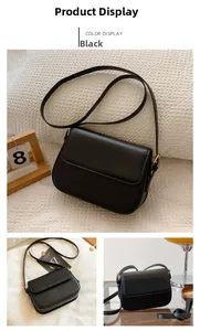 Détail du petit sac bandoulière en cuir noir mat avec boucle dorée et bandoulière réglable