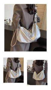 Detail showing the silver metallic hobo bag with unique pleated cloud shoulder strap