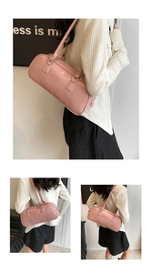 Close-up of pink cylindrical leather baguette bag with silver hardware and dual straps