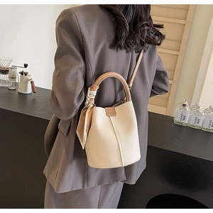 Litchi pattern bucket bag with silk scarf detail and long shoulder strap