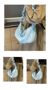 Three-frame view of a light blue pleated shoulder bag worn with a camel trench coat